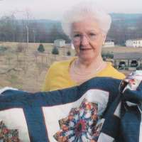 Delta Peterson with quilt